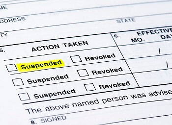 Form with an action taken section with checkboxes for suspended and revoked with the first suspended highlighted